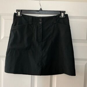 Nike Golf skort, black size 6 with built in shorts.